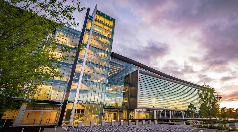 Modern glass corporate building at dusk
