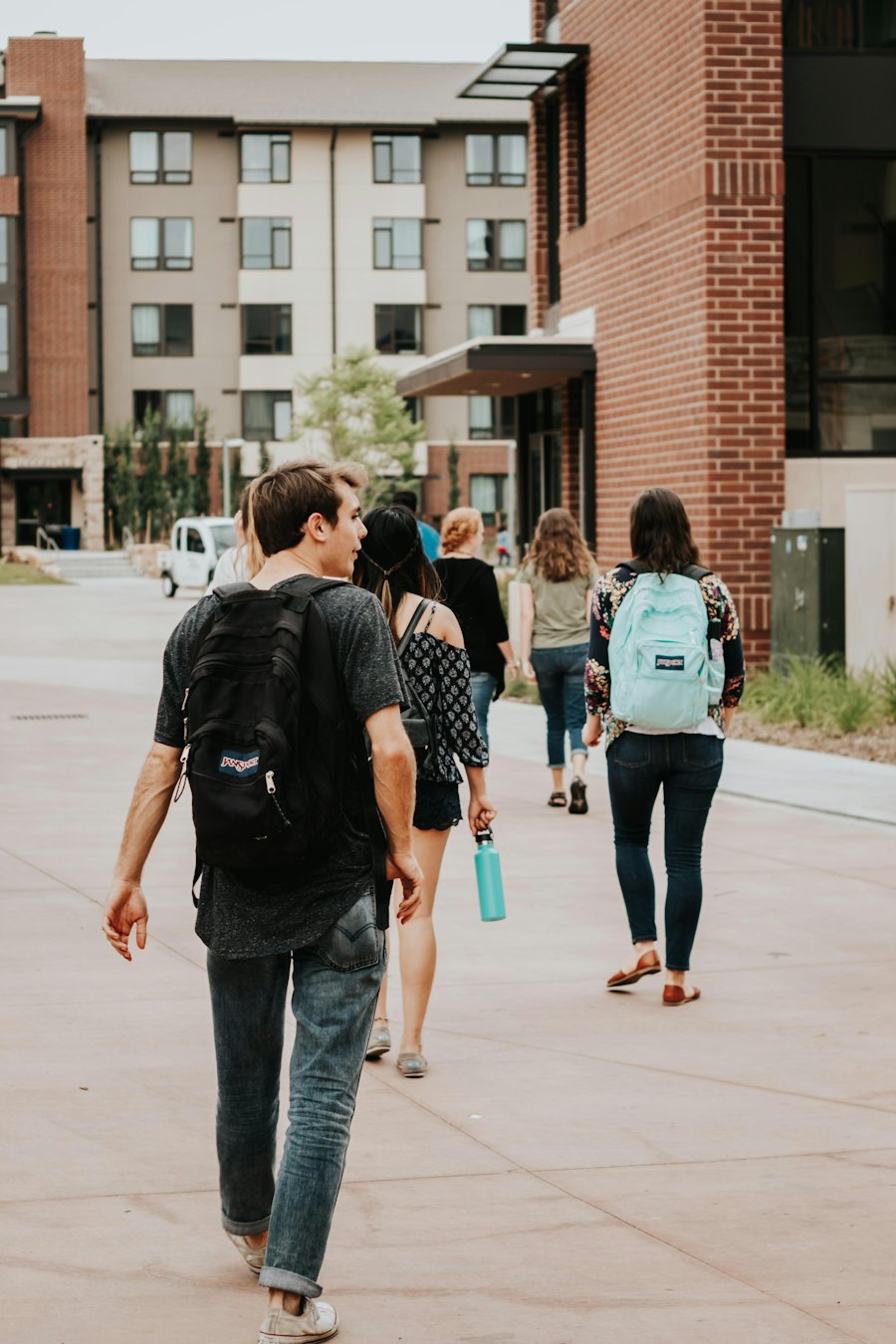 Students walking across a university campus